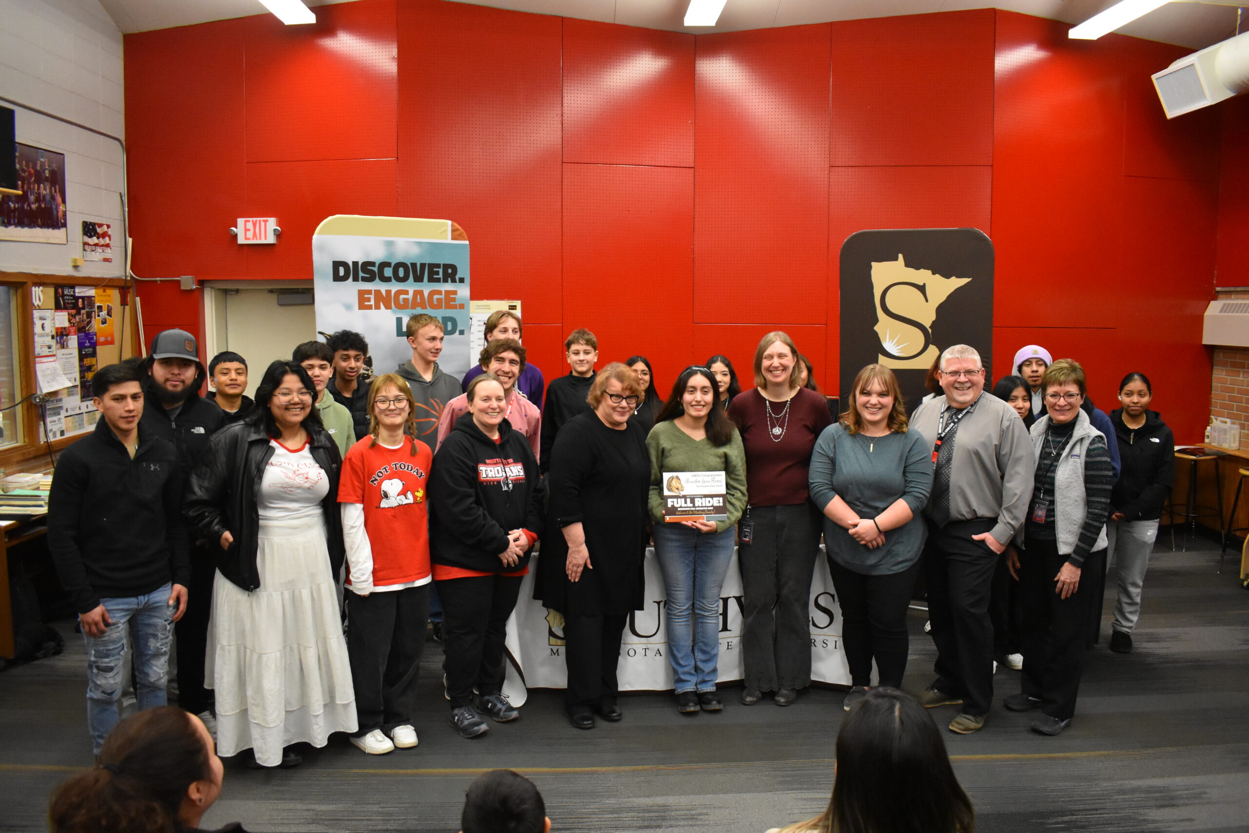 Alondra with staff and students in the band room