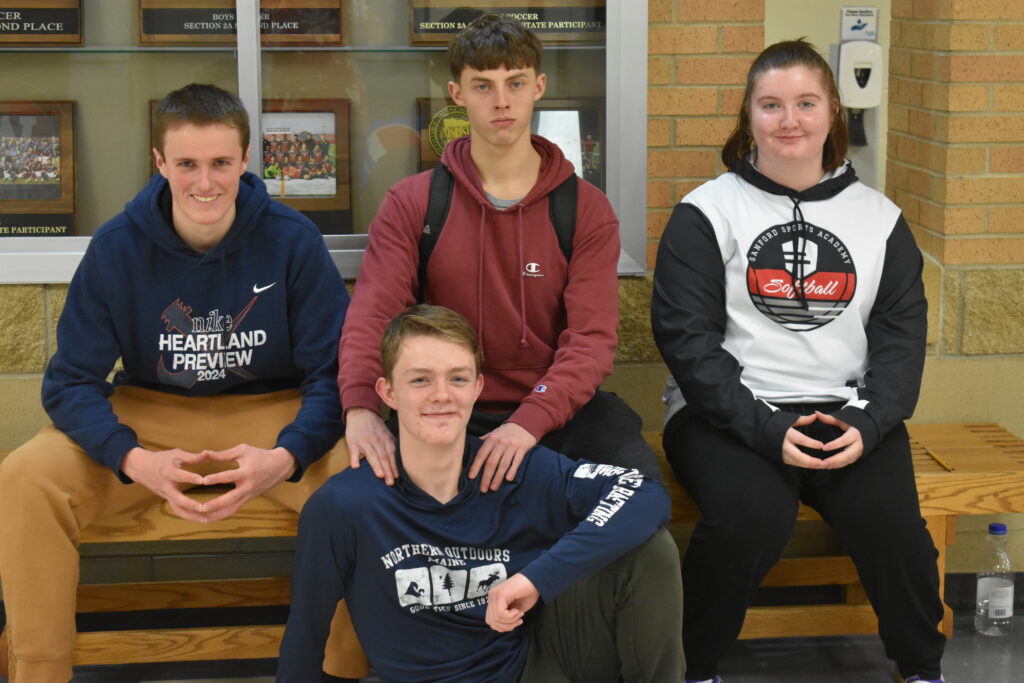 Four students sitting 