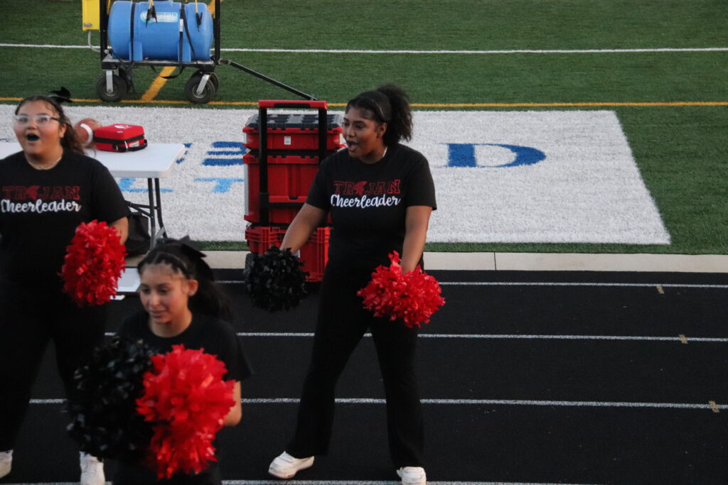 Cheerleading at football game.