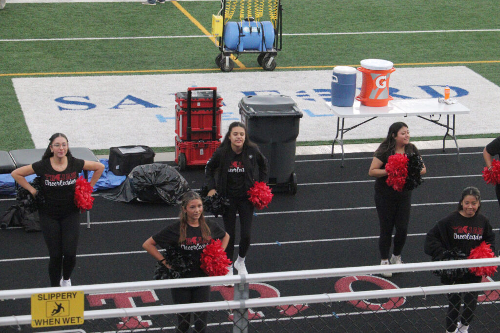 Cheerleading at football game.