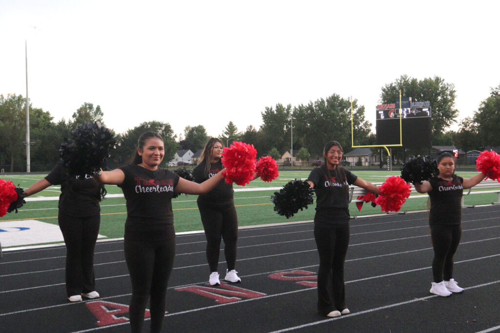 Cheerleading at football game.