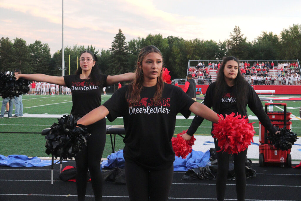 Cheerleading at football game.