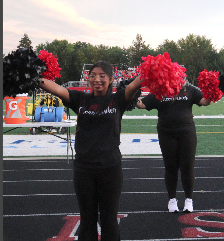 Cheerleading at football game.