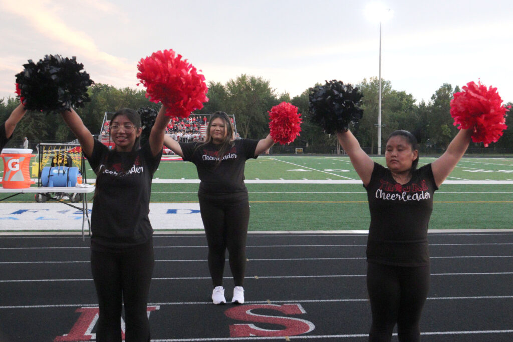 Cheerleading at football game.