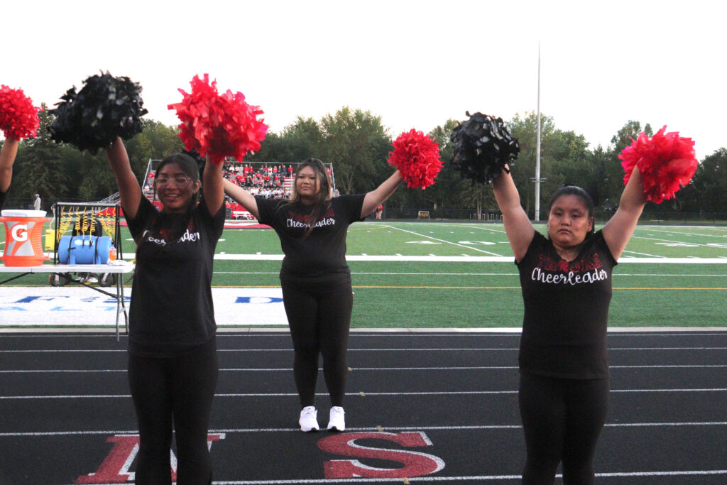 Cheerleading at football game.