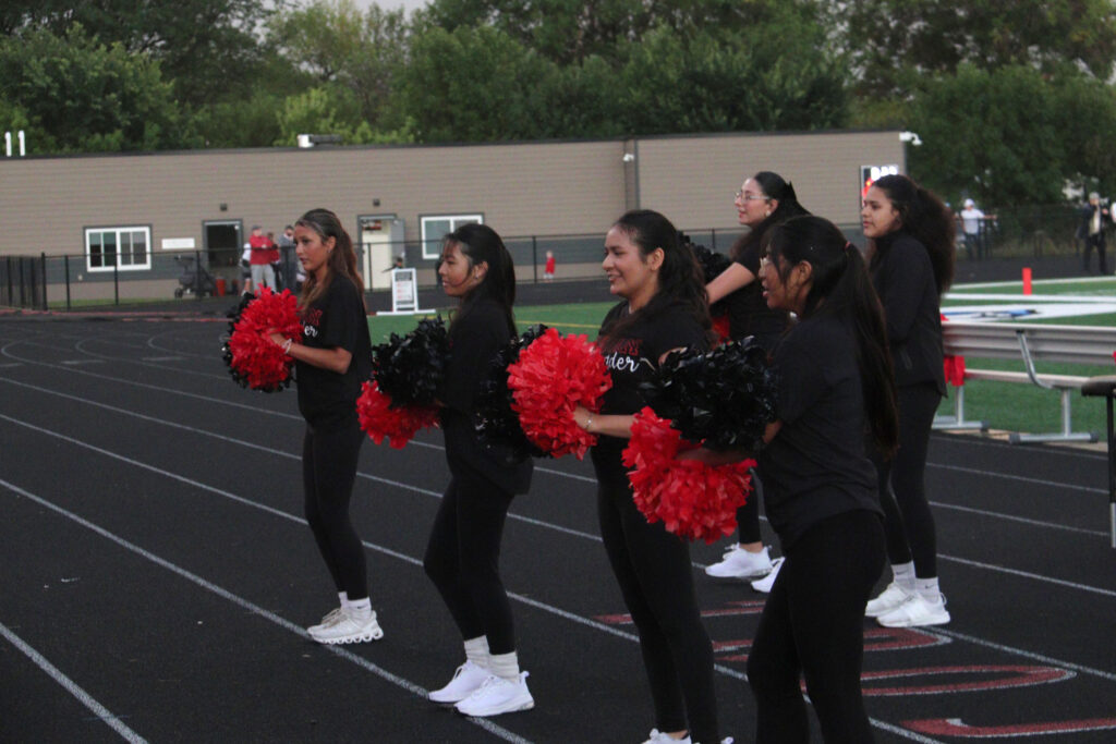 Cheerleading at football game.