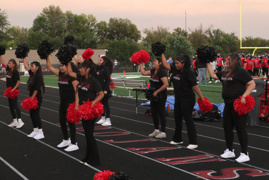 Cheerleading at football game.