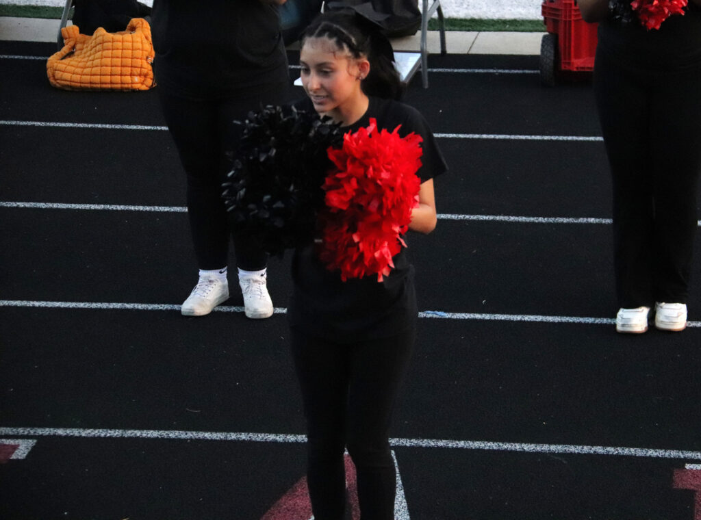 Cheerleading at football game.