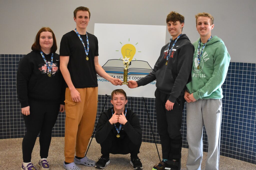 Isaac Kinser, Aiden Harwood, Isaiah Bates, Austin Kinser, and Katie Welch holding a trophy